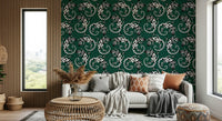 Gecko Groove wallpaper in green behind a grey sofa with throw pillows by a wood-slat wall in a living room