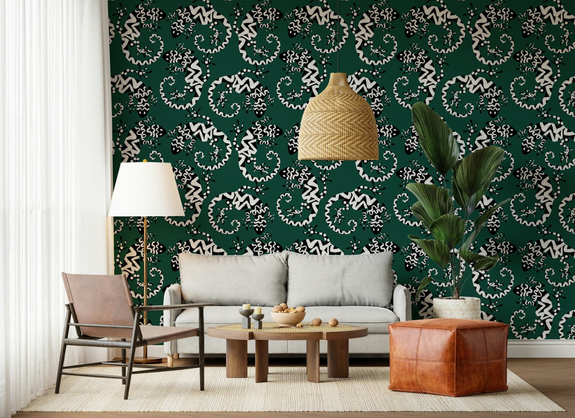 Gecko Groove wallpaper in green behind a grey sofa with a leather pouf and rattan pendant in a living room