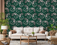 Gecko Groove wallpaper in green and white behind a cream sofa and rattan chair in a cozy living room
