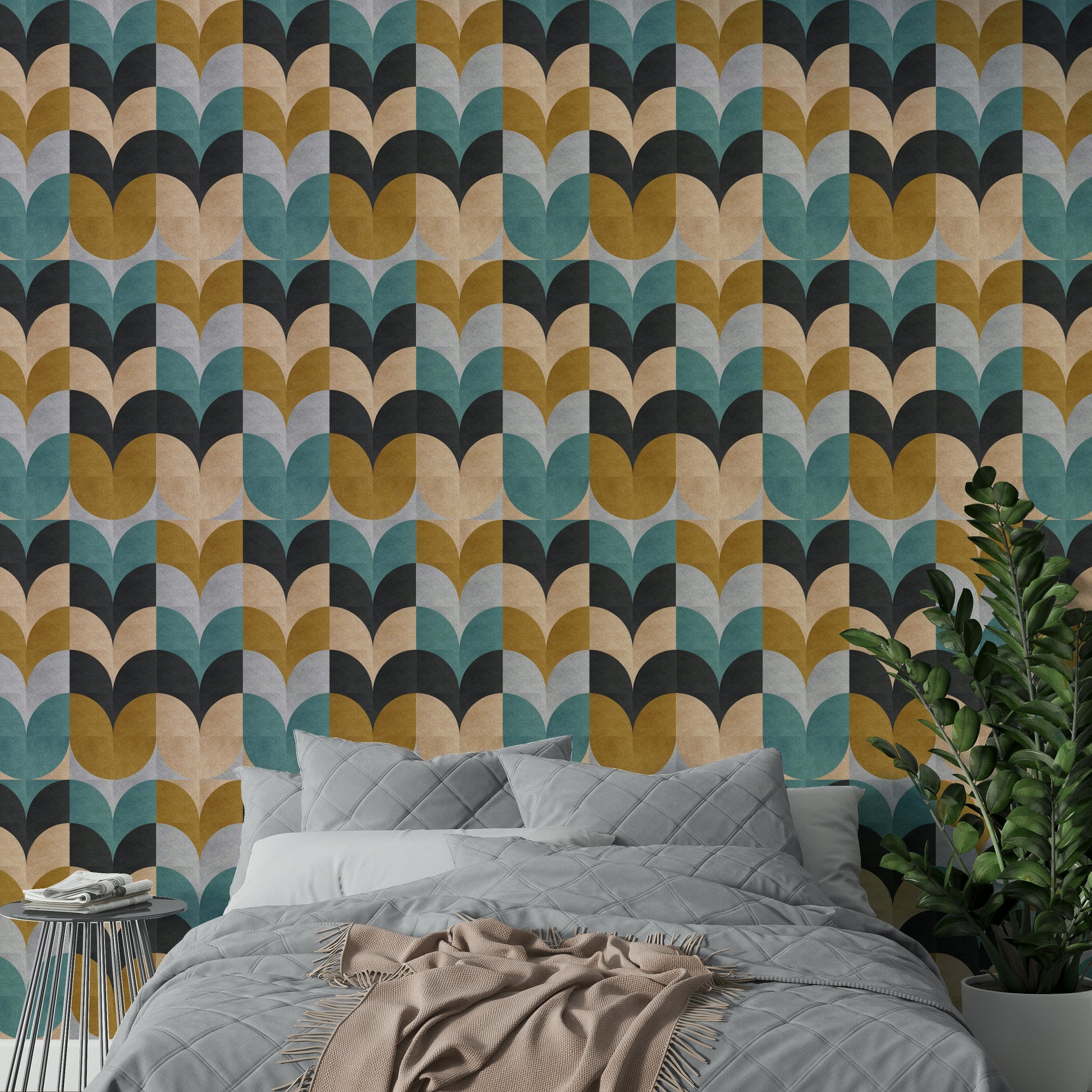 Geometric Art wallpaper with retro scallop blocks behind a grey quilted bed and potted ZZ plant in a bedroom