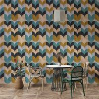 Geometric Art wallpaper of teal and mustard scallops beside a round white table and rattan chairs in a nook