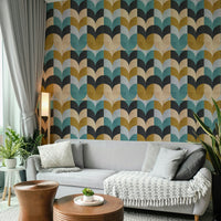 Geometric Art wallpaper with retro petal blocks behind a light grey sofa and wooden tables in a living room