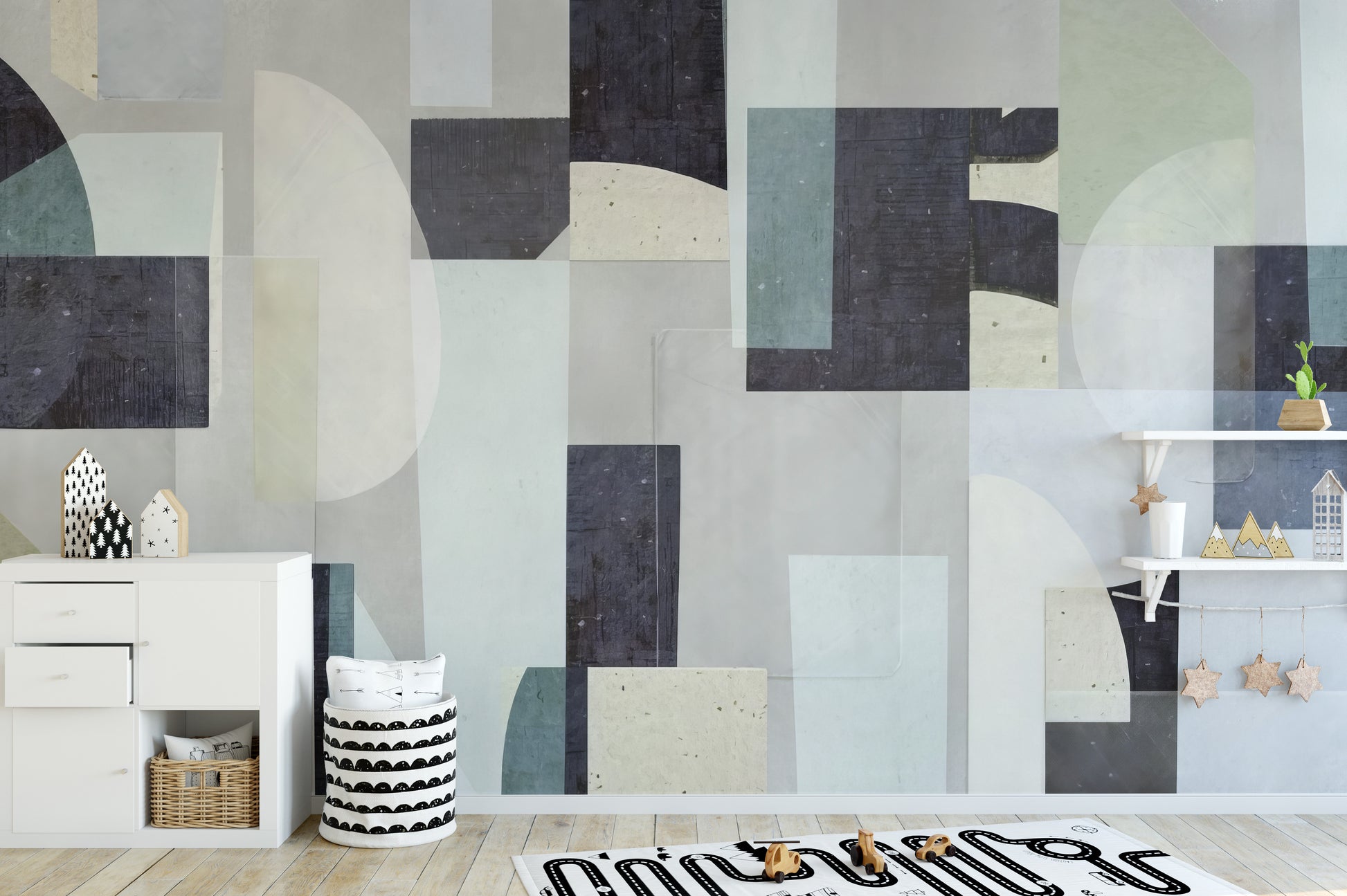Abstract Geometric wallpaper mural with navy and sage blocks in a kids room with a white dresser and toy shelf