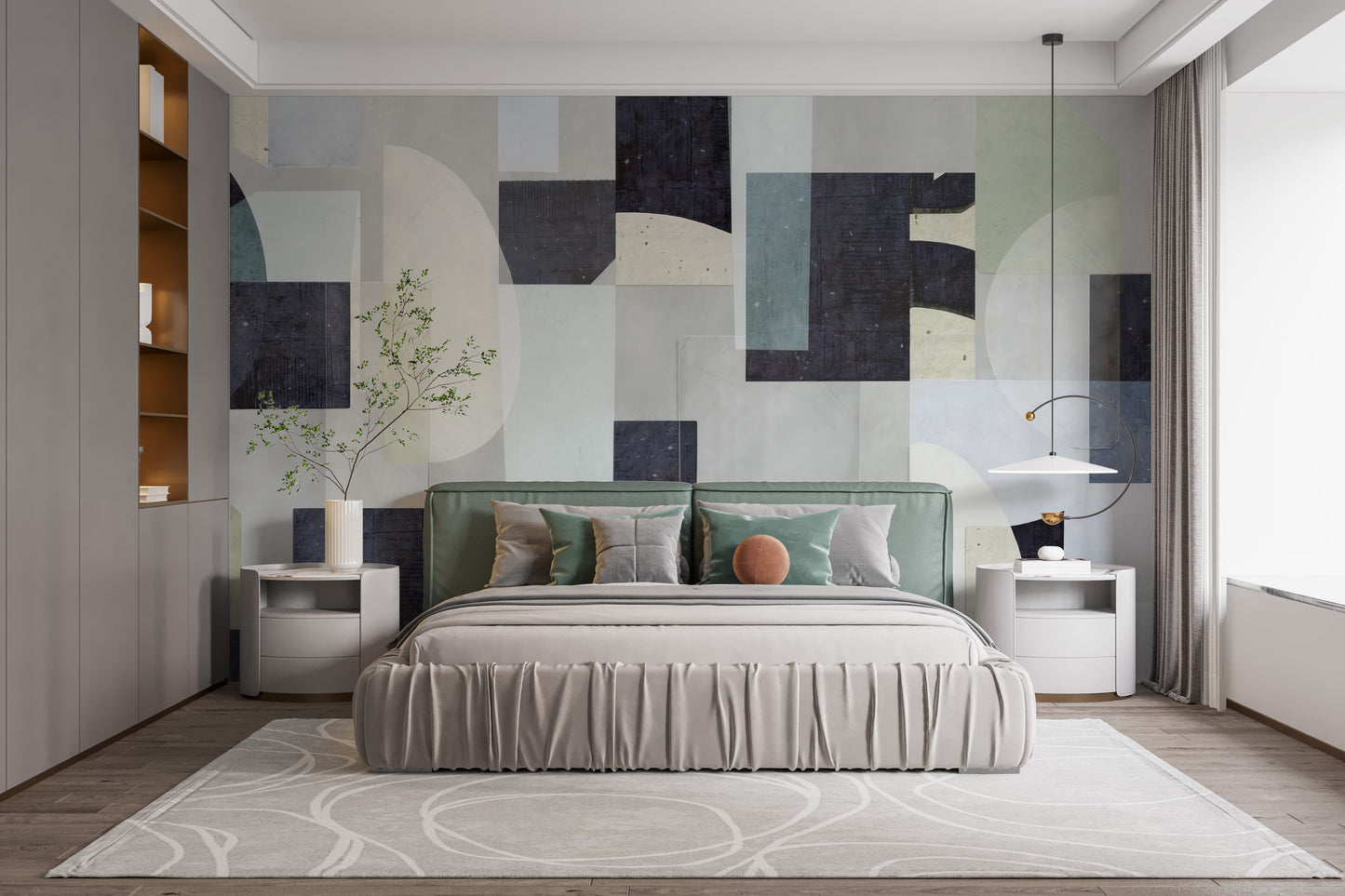 Abstract Geometric wallpaper mural in navy and sage blocks above a green upholstered bed in a modern bedroom