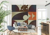 Bold geometric wallpaper displaying symmetrical orange shapes against dark blue background.