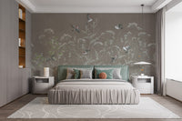Meadow Melody wallpaper mural of taupe meadow grasses and birds behind a green headboard bed in a bedroom