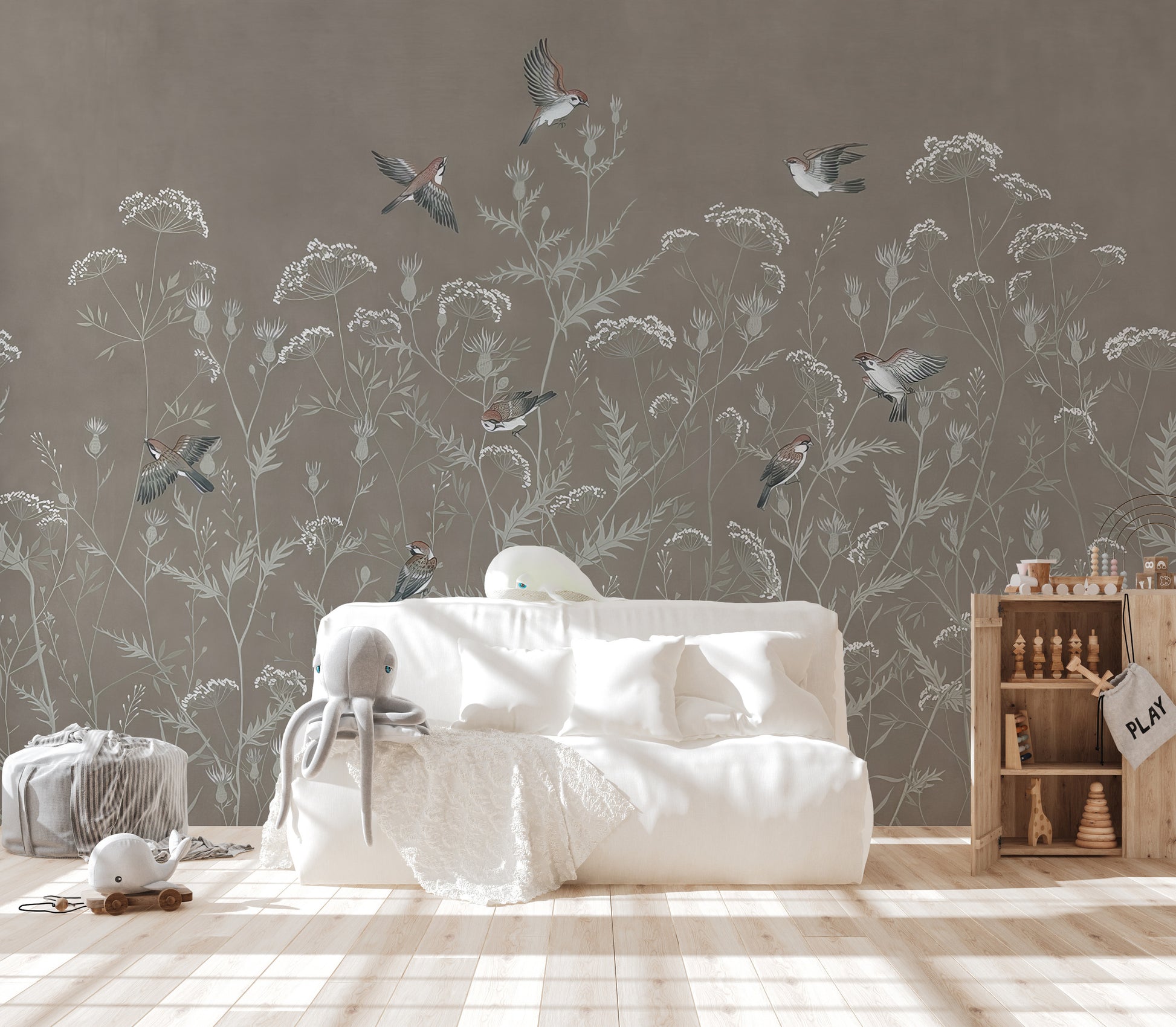 Meadow Melody wallpaper mural of meadow flowers and flying sparrows behind a white daybed in a playroom