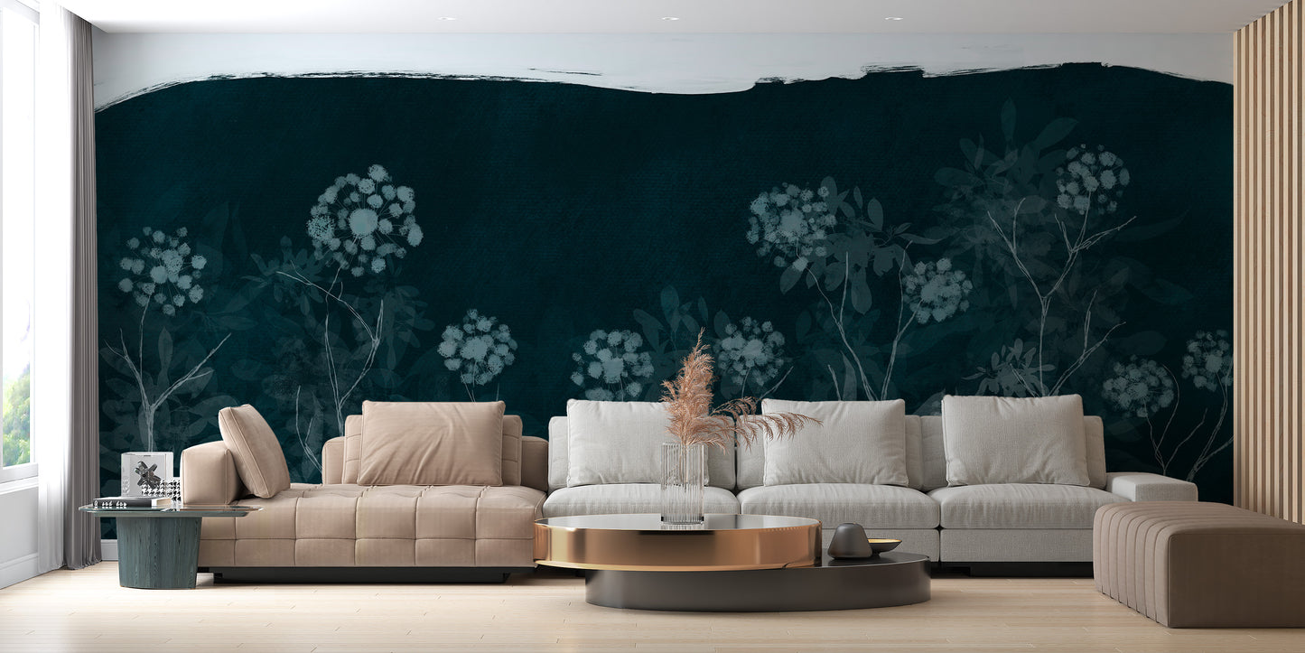 Midnight Botanical wallpaper mural in deep teal behind a long cream sectional sofa in a bright living room