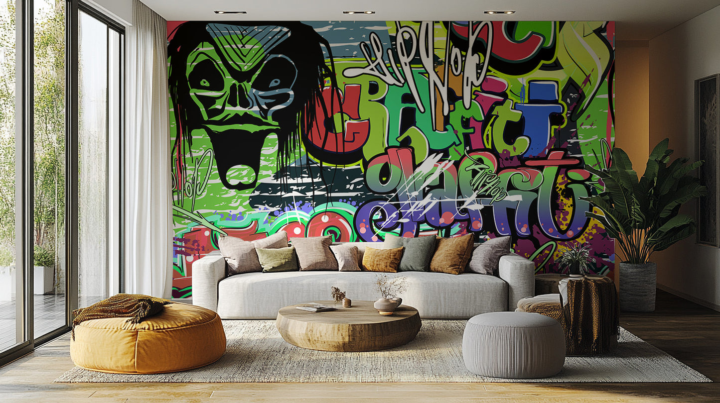 Vibrant Graffiti wallpaper mural behind a grey sofa, round wooden coffee table and mustard bean bag in a living room