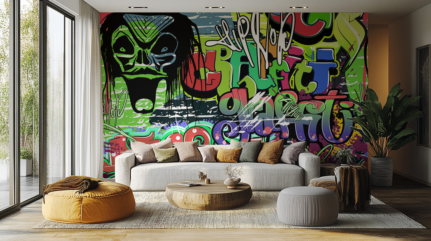 Vibrant Graffiti wallpaper mural behind a grey sofa, round wooden coffee table and mustard bean bag in a living room