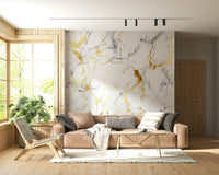 Luxurious marble wallpaper with gilded swirls and dynamic flowing patterns.