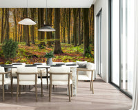 Golden light filtering through Gilded Woods wall covering scenery.