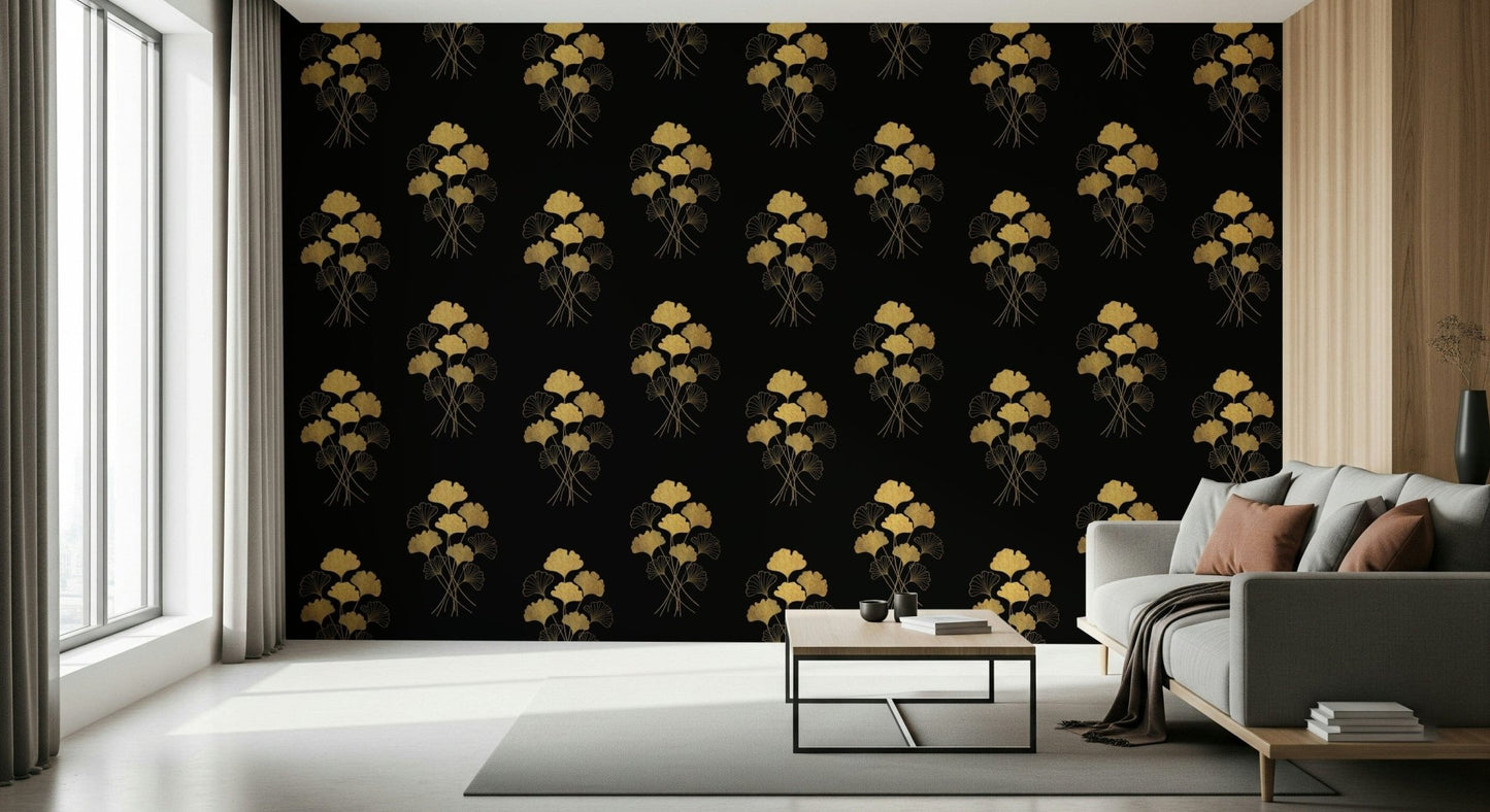 Ginkgo Luxury Gold wallpaper mural of gold ginkgo sprays on black behind a gray sofa and wood table in a bright living room
