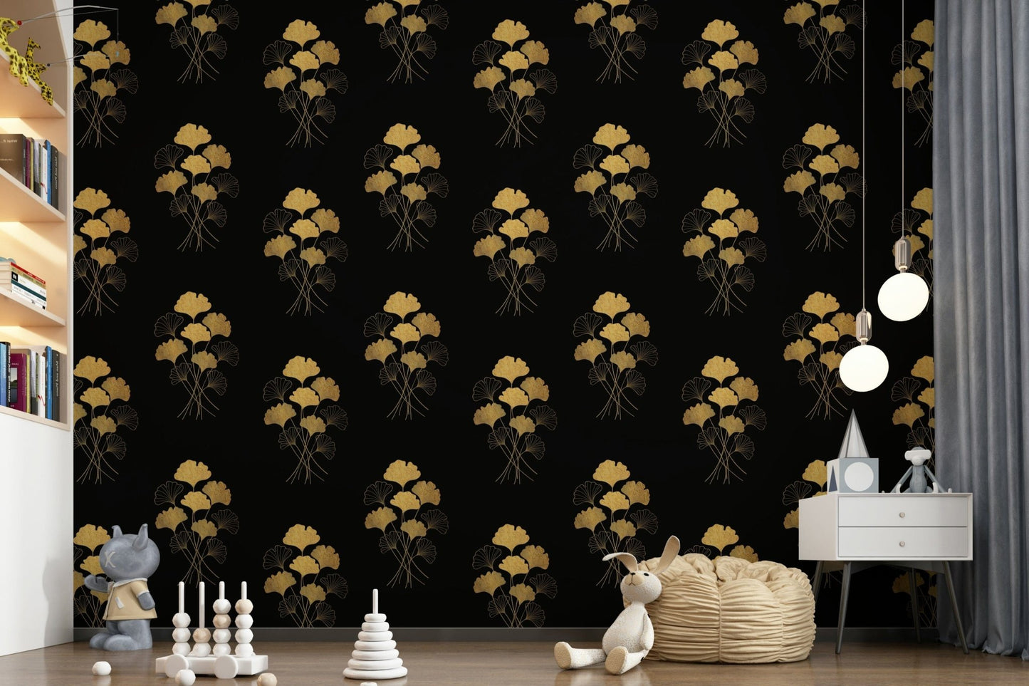 Ginkgo Luxury Gold wallpaper mural with gold ginkgo leaves on black behind a bean bag and toys in a child's room