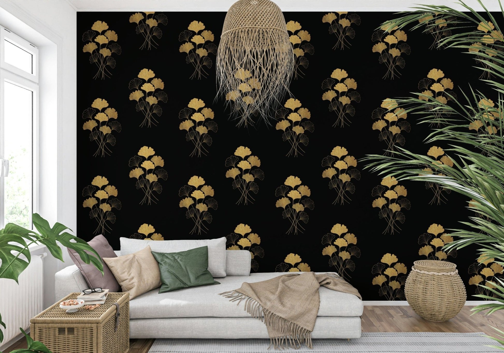 Ginkgo Luxury Gold wallpaper mural with gold ginkgo sprays on black behind a white chaise sofa in a living room
