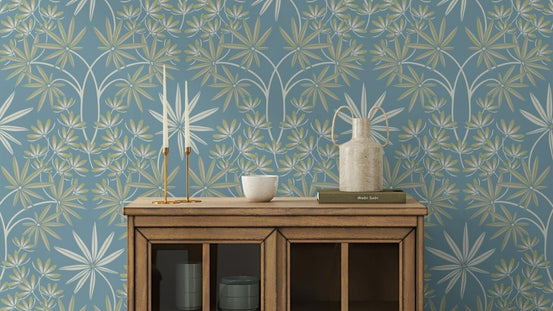 Glamour Floral Damask wallpaper with cream and sage blooms on soft blue behind a wooden sideboard