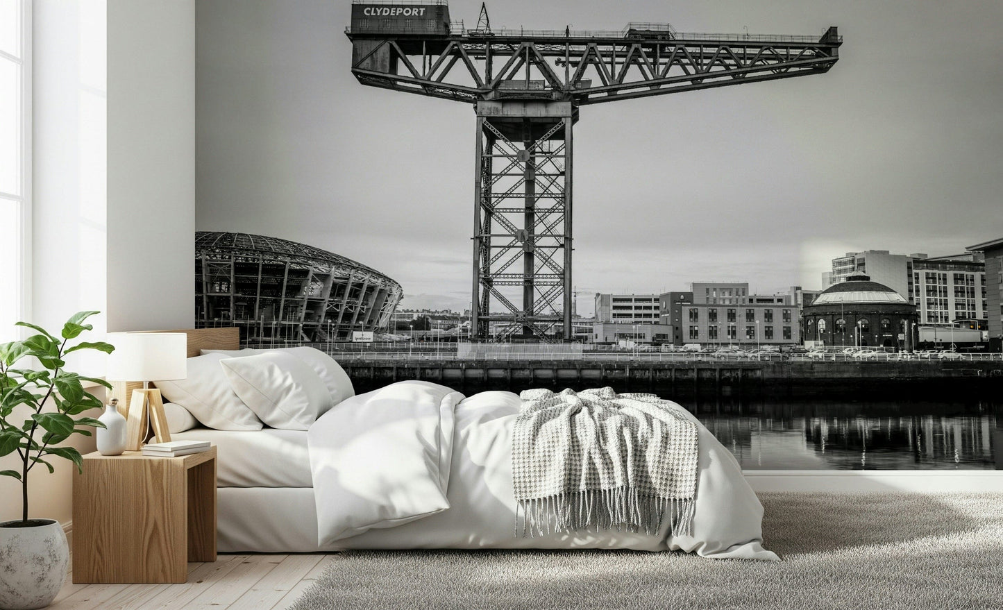 Large cityscape wallpaper behind sofa in apartment, muted colours, Glasgow-inspired urban mural