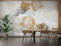 Gold Black Modern Floral wallpaper mural in gold and grey behind a wood dining table and chairs with a potted palm