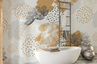 Gold Black Modern Floral wallpaper mural of ochre flowers and dots behind a white freestanding tub and towel ladder
