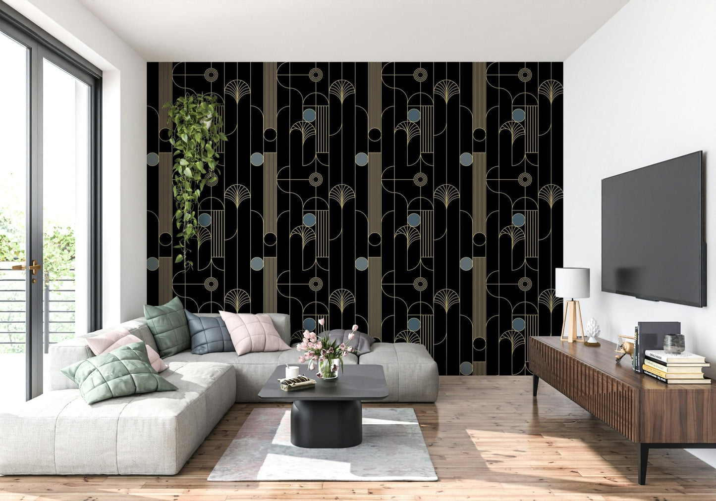Golden Arcadia Harmony Deco wallpaper in black and gold deco pattern behind a grey sectional with wood TV console