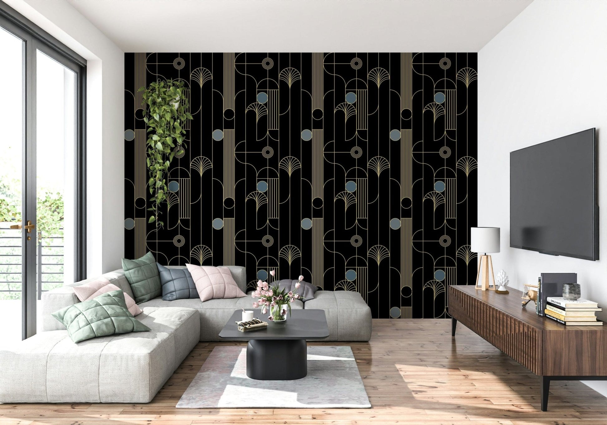 Golden Arcadia Harmony Deco wallpaper in black and gold deco pattern behind a grey sectional with wood TV console