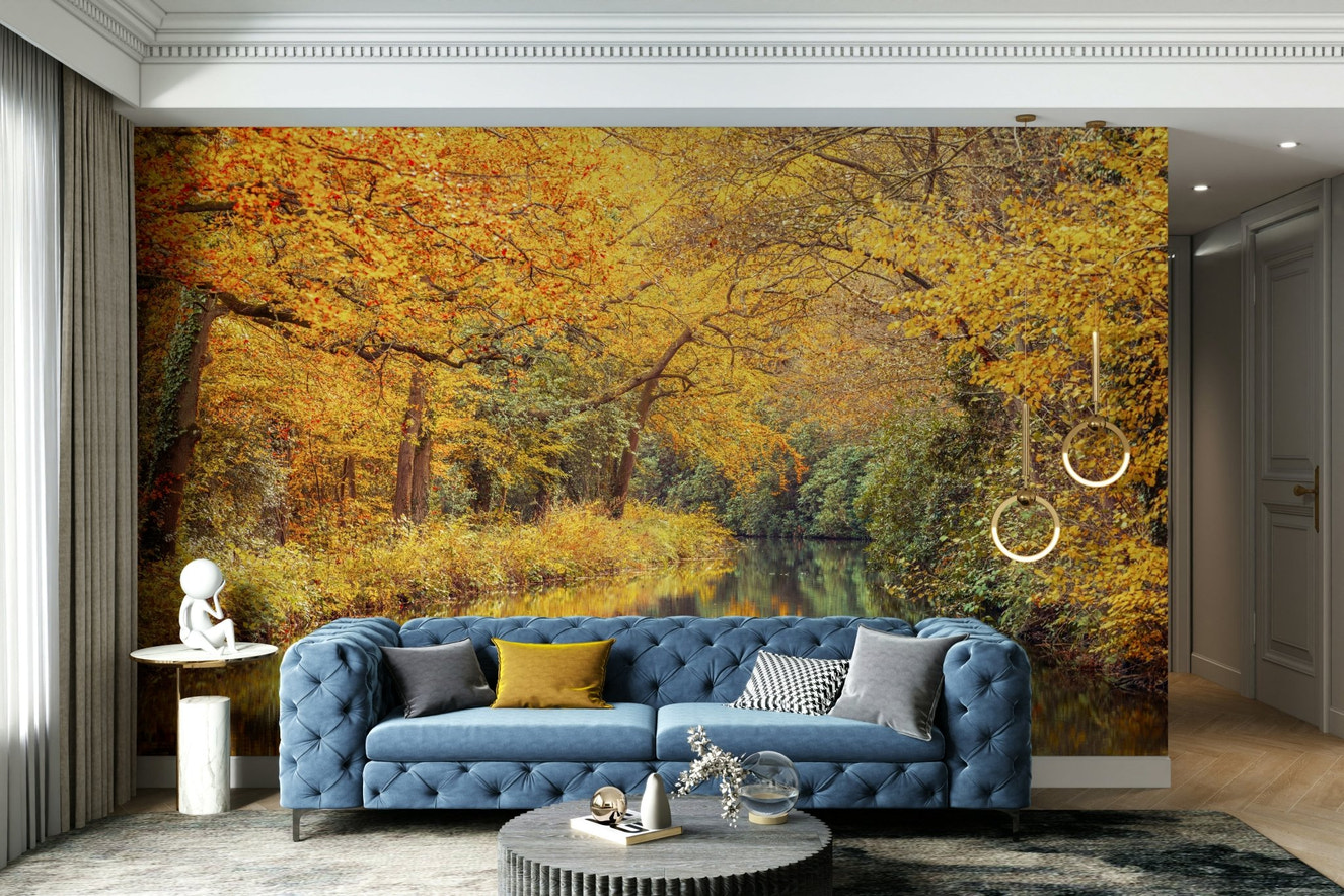 A wall mural of a stream in an autumn forest.

