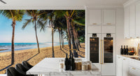 Golden Beach Palms wallpaper mural with a palm beach behind a white marble kitchen island and bar stools