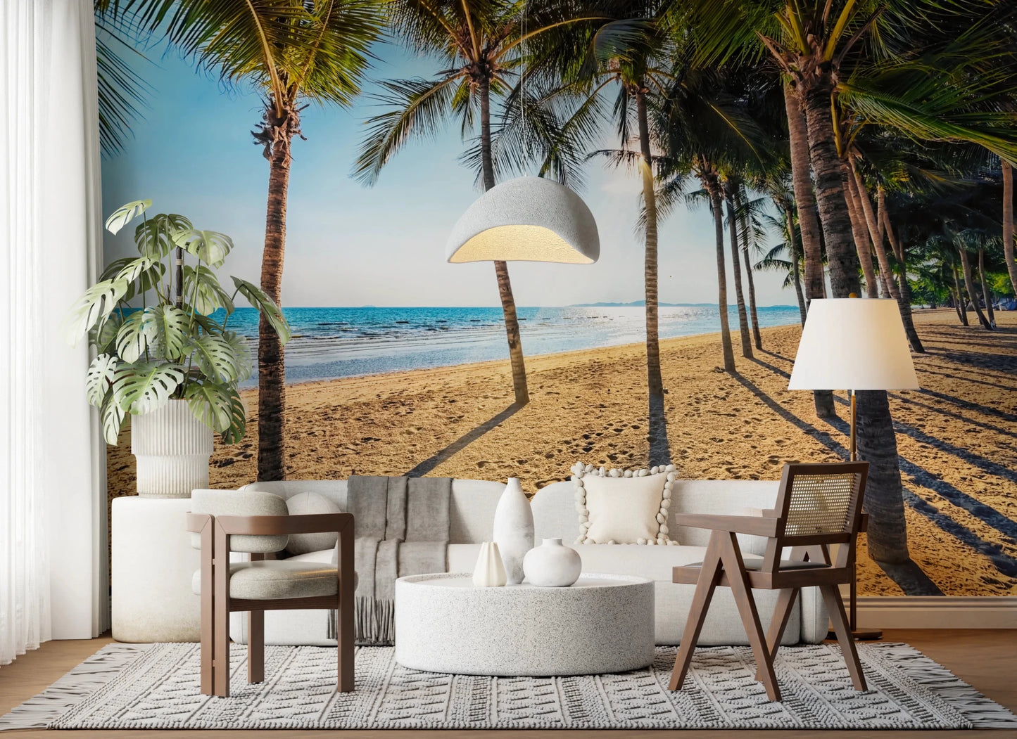 Golden Beach Palms wallpaper mural with a tropical beach behind a white sofa and terrazzo table