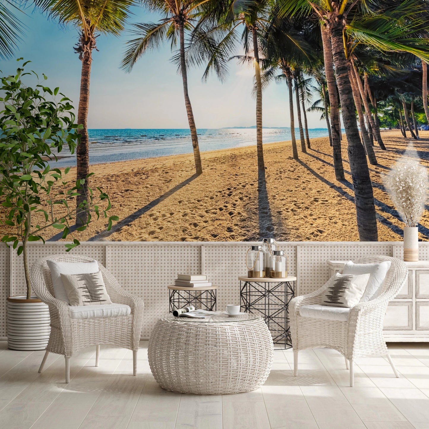 Golden Beach Palms wallpaper mural of palms on sand behind two white wicker armchairs on a terrace