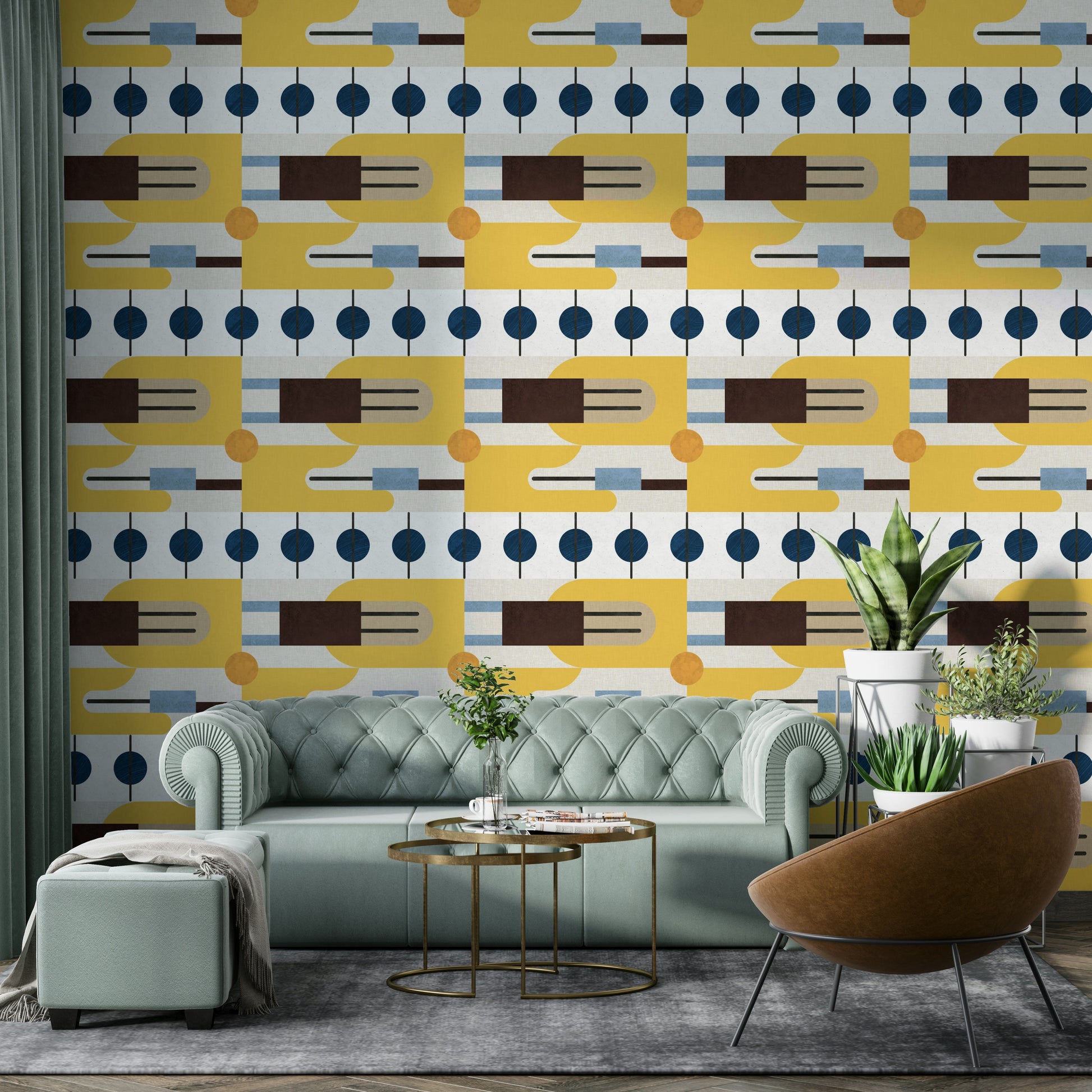 Golden Hour Hues wallpaper with mid-century geometry behind a mint-green chesterfield sofa and leather chair