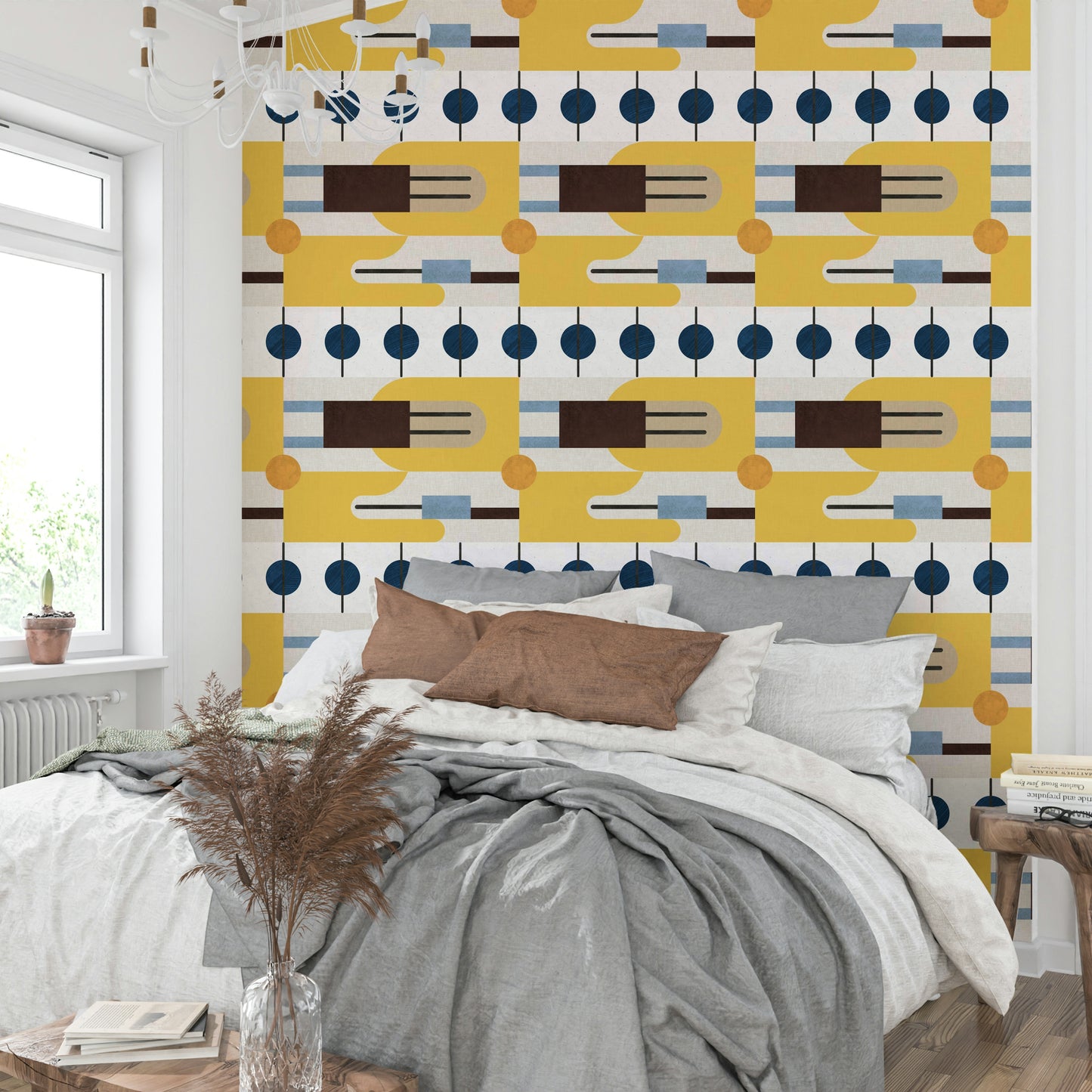 Golden Hour Hues wallpaper in a bright bedroom with a grey bed, brown pillows and pampas grass