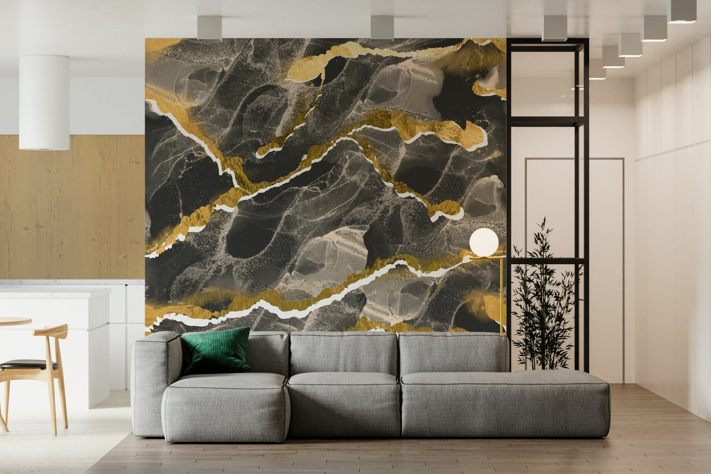 Golden Veins Charcoal Marble wallpaper mural behind a grey sectional sofa with bamboo plant in a modern living room