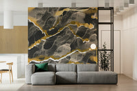 Golden Veins Charcoal Marble wallpaper mural behind a grey sectional sofa with bamboo plant in a modern living room