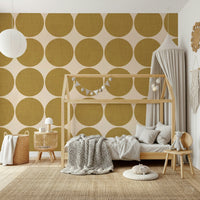 Repeating pattern of textured ochre round shapes on a warm neutral backdrop