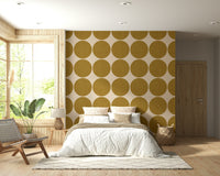Modern geometric wallpaper with oversized ochre dots arranged in a uniform repeating grid