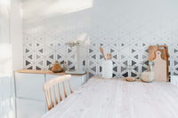 Scandi-style wall mural showing soft pastel circular motifs.