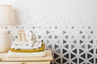 Abstract navy and white wall mural with sharp angular patterns.