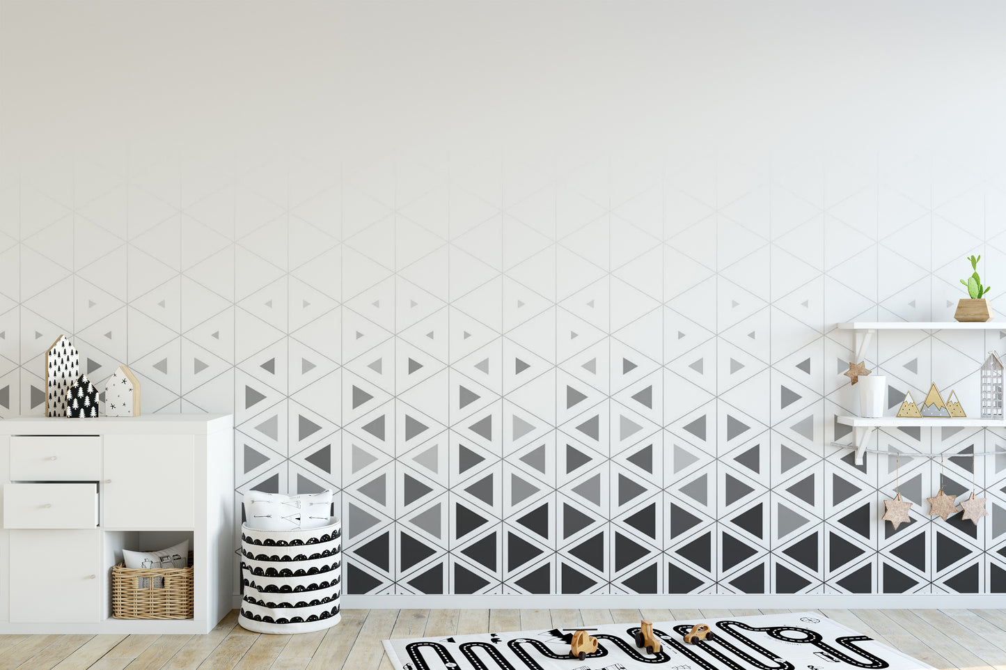 Geometric pattern play room wall mural with interlocking matte grey triangles.