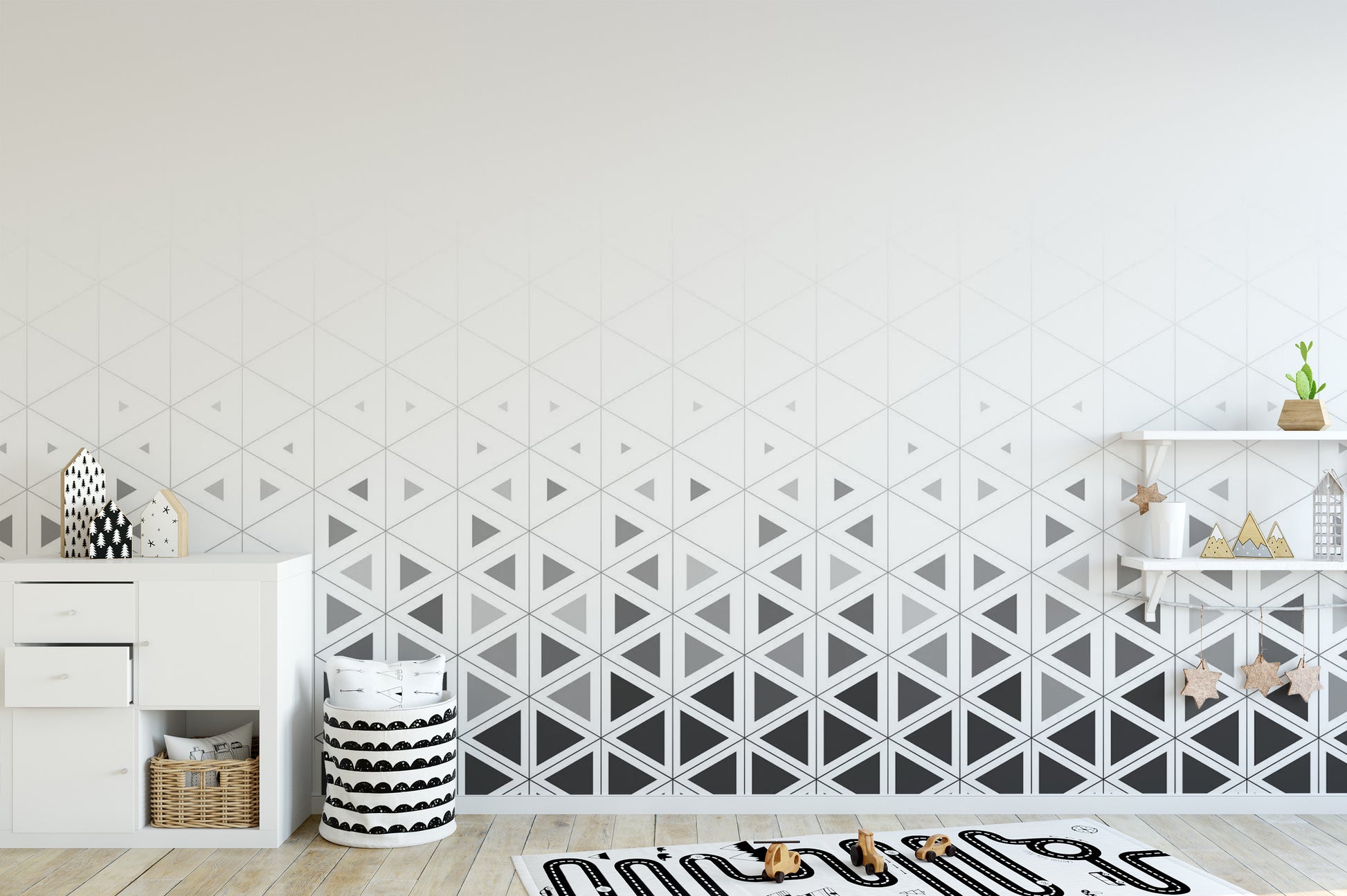 Geometric pattern play room wall mural with interlocking matte grey triangles.