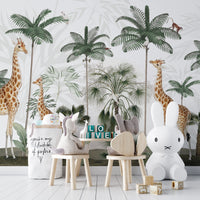 Gracious Giraffes wallpaper with palms and monkeys in a play area with plush toys and a bunny lamp