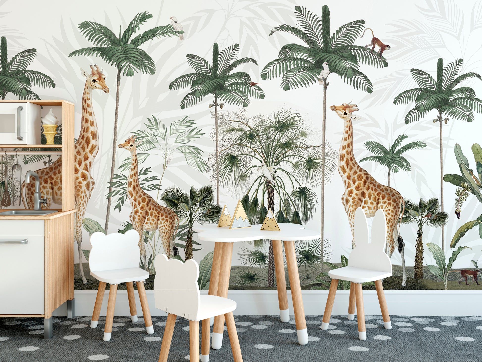 Gracious Giraffes wallpaper with palms and monkeys in a kids playroom with bear and bunny chairs