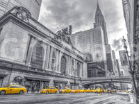 Grand Central Terminal in black and white with yellow taxis and the Chrysler Building shown as a full-wall mural