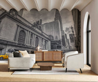 Grand Central Terminal mural in a living room with a cream sofa, rattan sideboard and scalloped ceiling