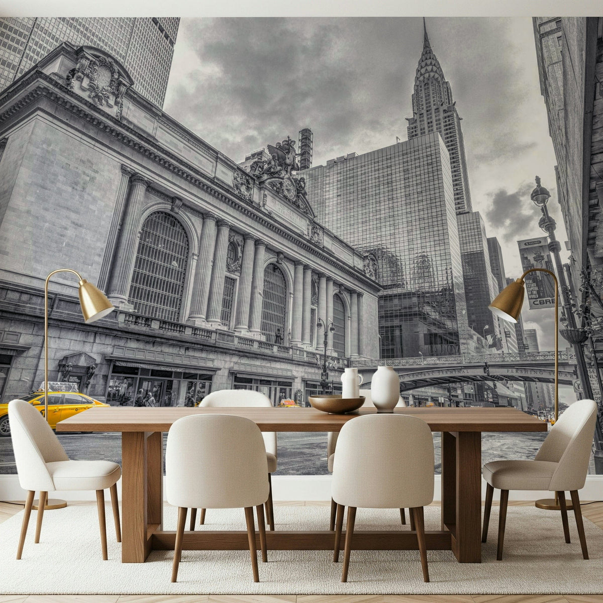Grand Central Terminal mural behind a wood dining table, cream chairs and brass floor lamps in a dining room
