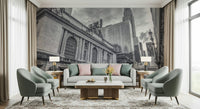 Grand Central Terminal mural behind a grey sofa and sage green armchairs with pink and green pillows