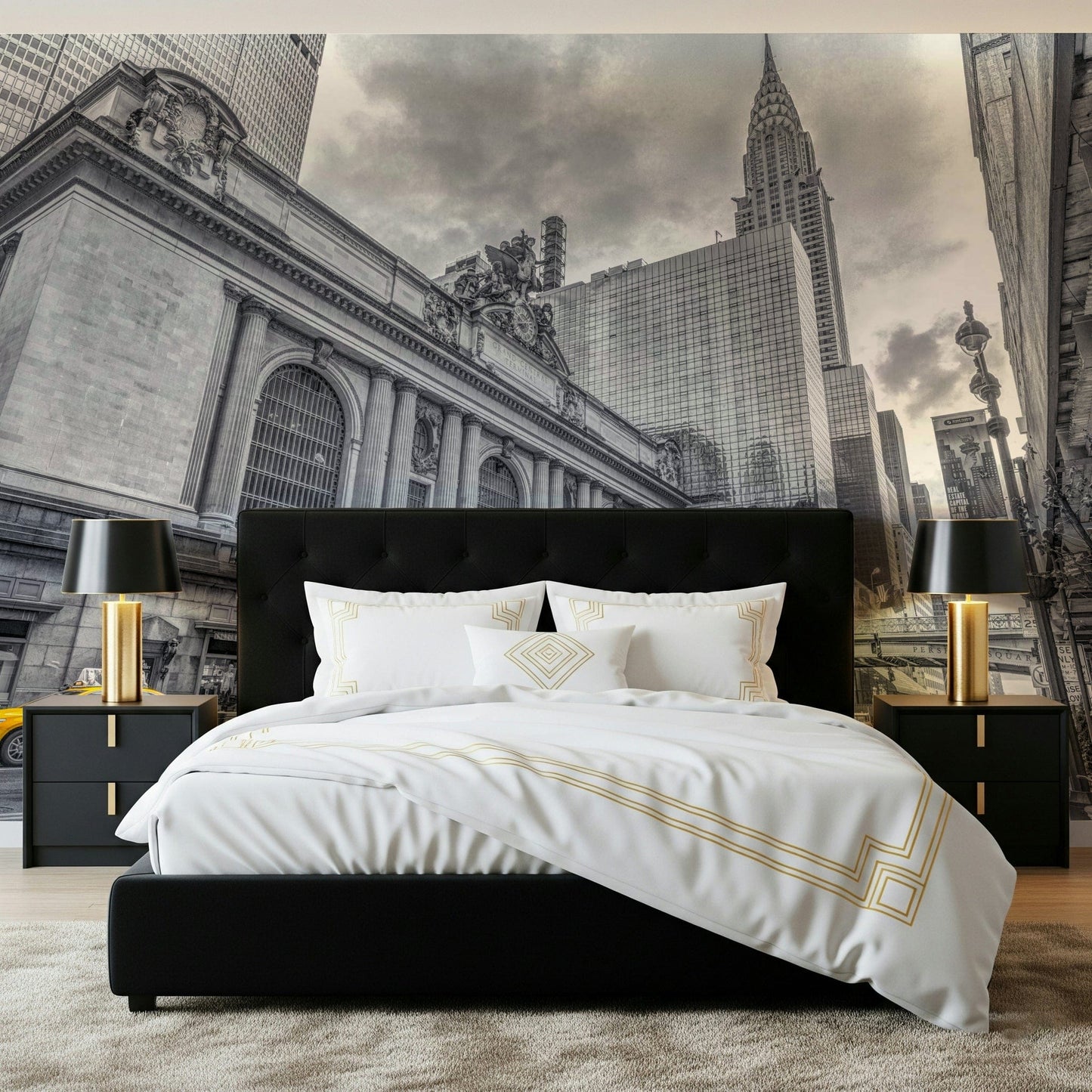Grand Central Terminal mural in black and white with yellow taxis behind a black bed with white and gold bedding