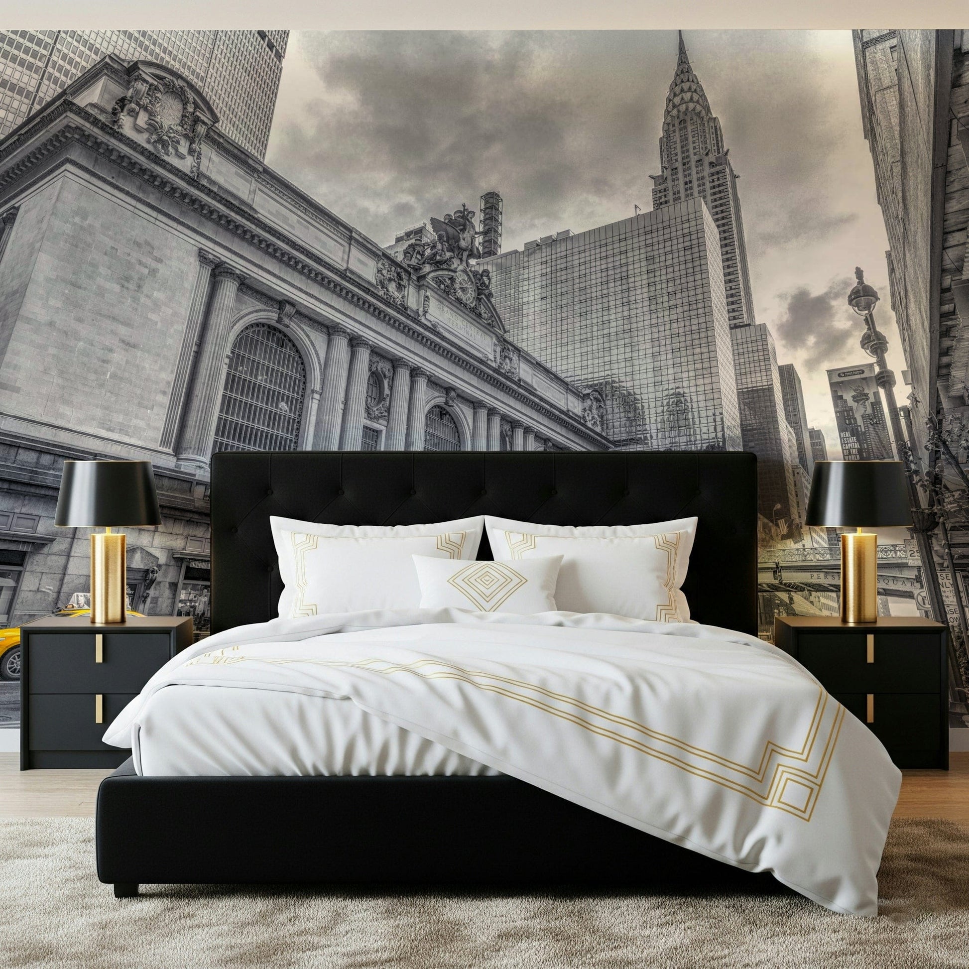 Grand Central Terminal mural in black and white with yellow taxis behind a black bed with white and gold bedding