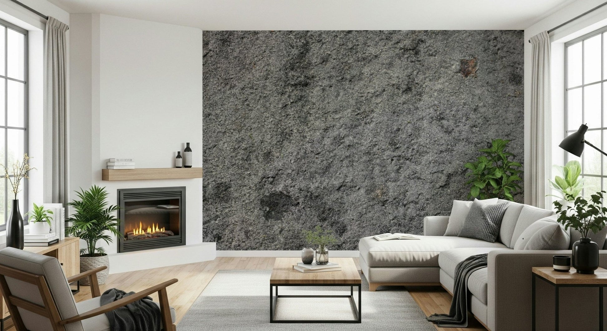 Granite Gray wallpaper mural behind a white sectional sofa beside a lit fireplace and leafy plants