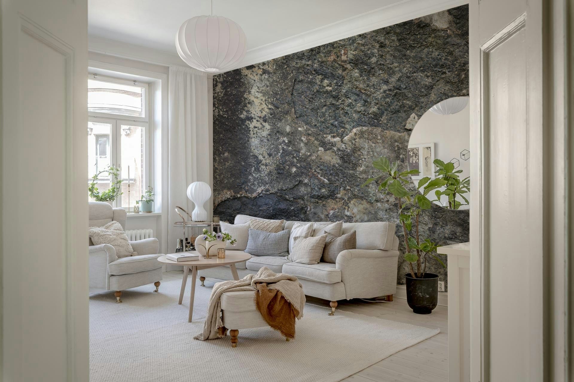 Nature-inspired rock wall mural in modern living room, neutral color tones, feature wall use
