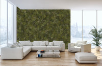 Green Embroidery Ferns Bracken wallpaper mural behind a white sectional sofa in a sunlit living room by snowy windows